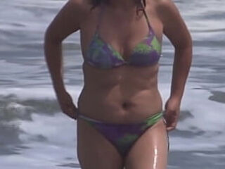 Cool 59-year-old mature Latina puts on a bathing suit to demonstrate off on the beach